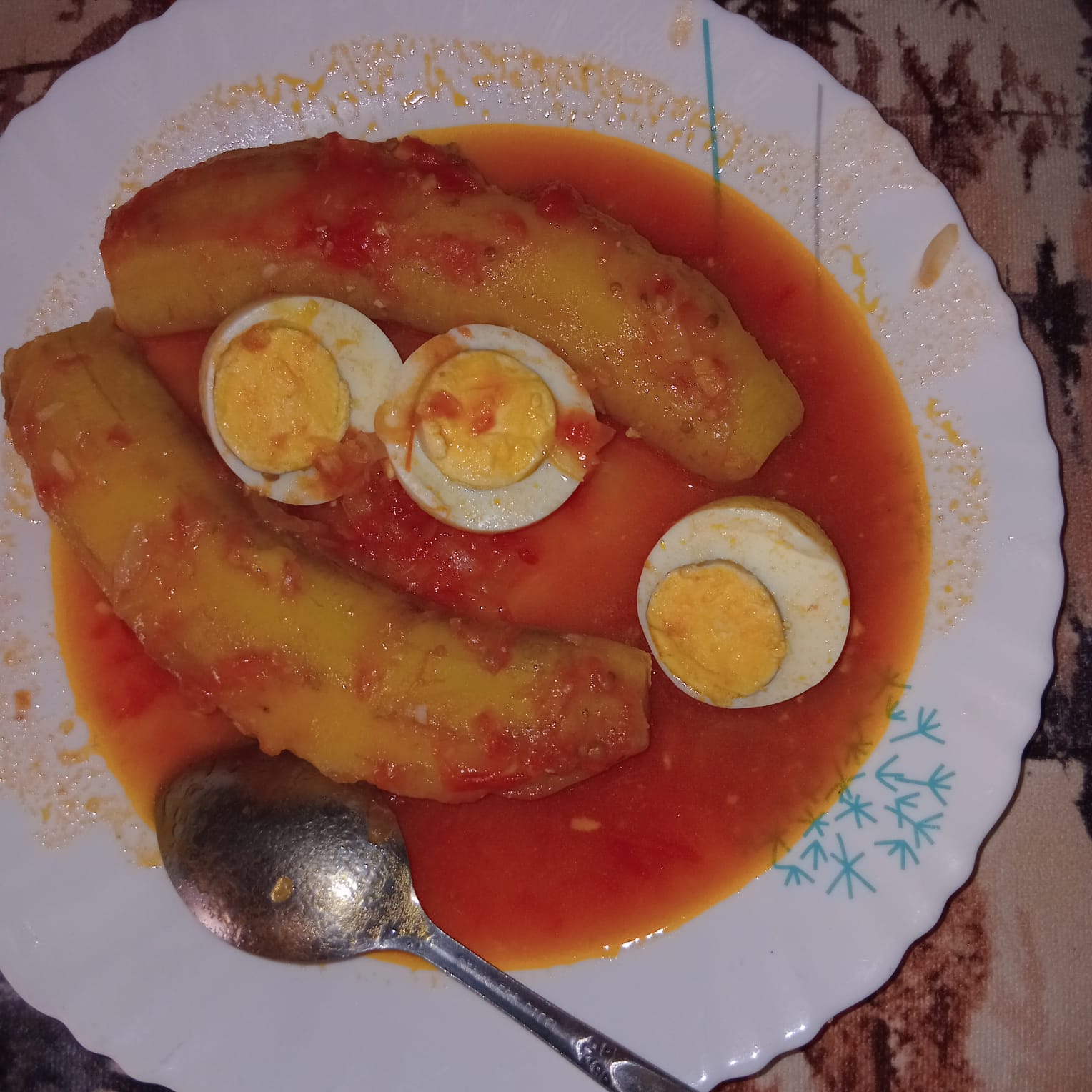 Maureen’s boiled eggs with matoke in tomato sauce